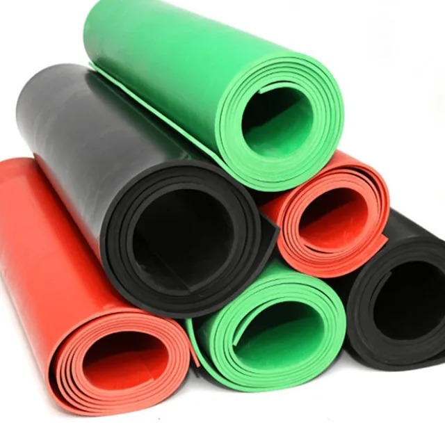 Rolled rubber sheets in black, green and red